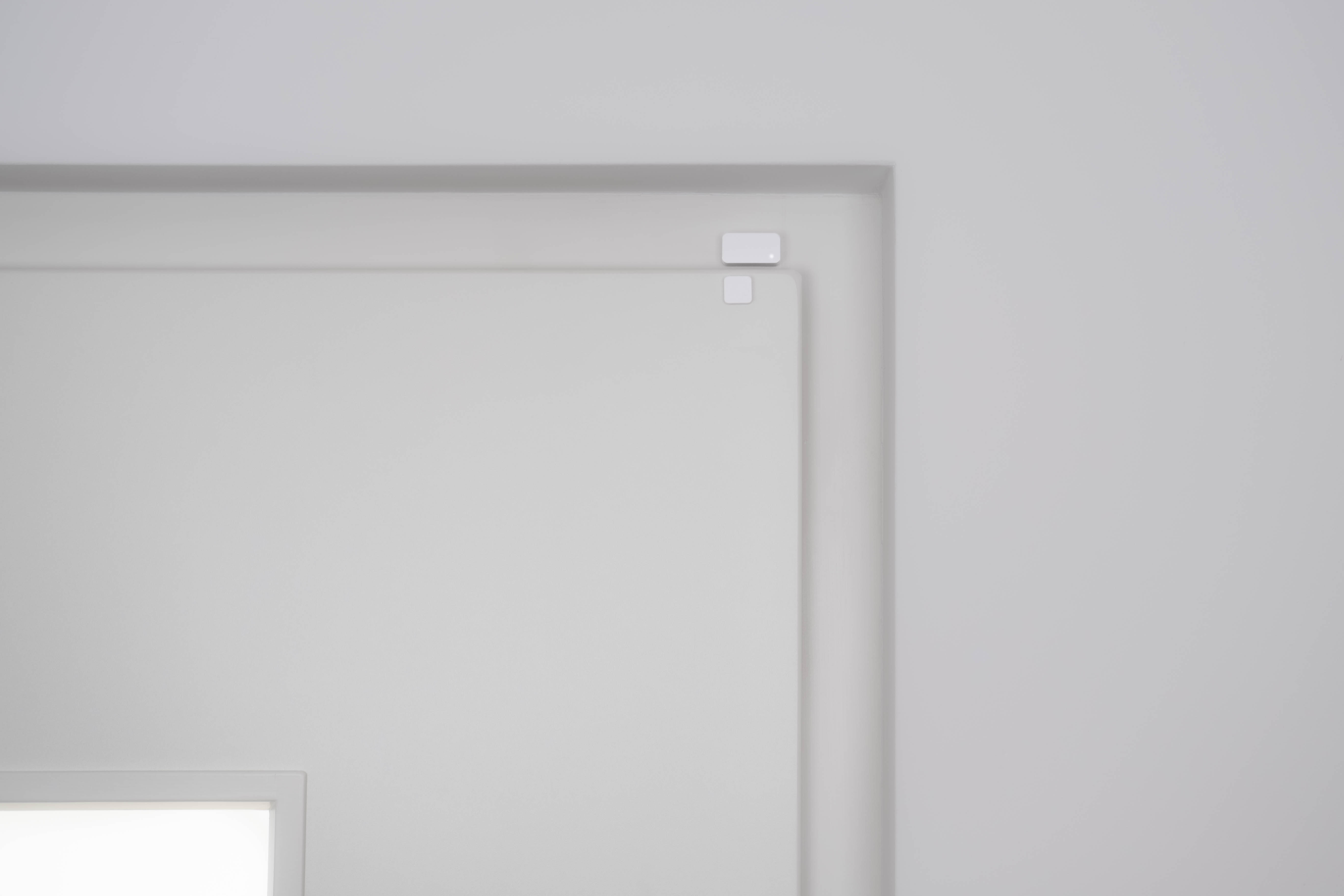 Door Sensor Mounting Example A1: If the door and the frame are at the same level, the Door Sensor and the Magnet can be applied parrallel on the top of the door